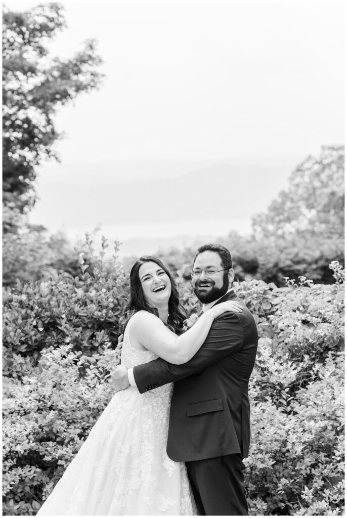 bride and groom laughing on the grounds at Briarcliff Manor in New York