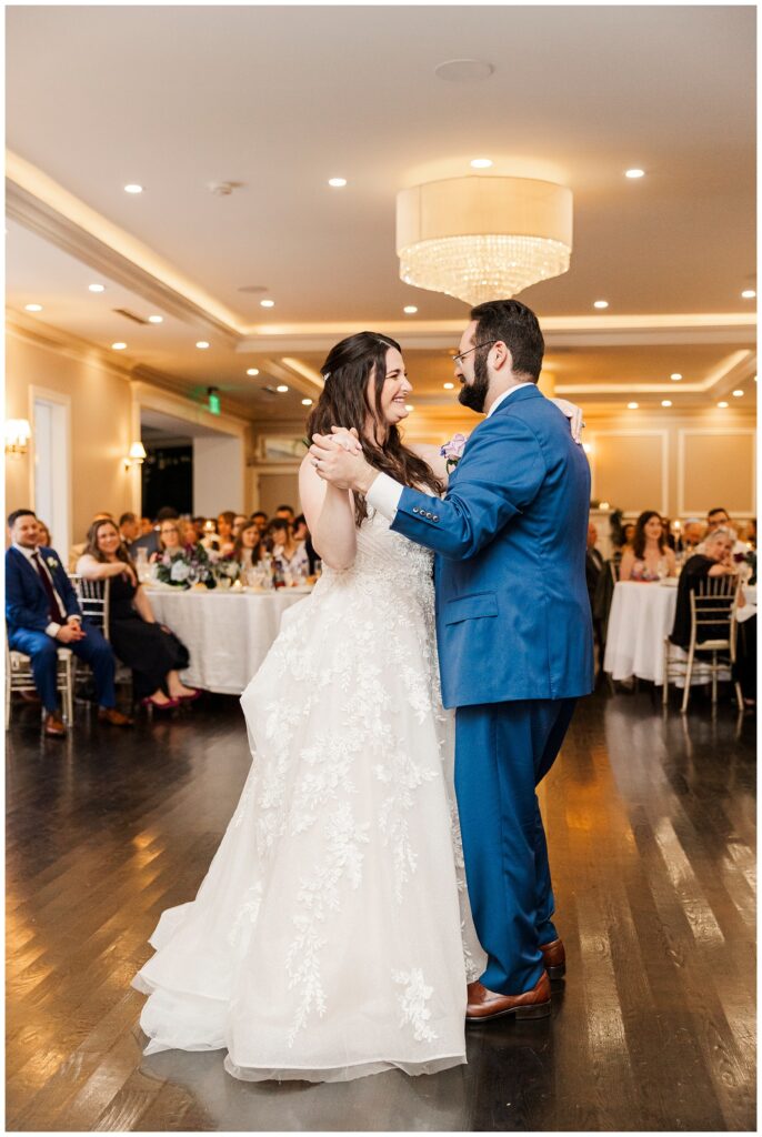 bride and groom share first dance at indoor reception in Hudson Valley