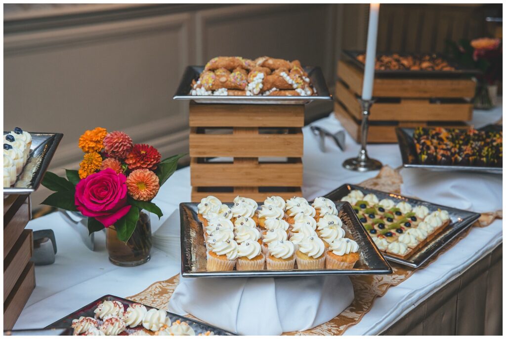 table of reception food and cupcakes at Asbury Park wedding venue