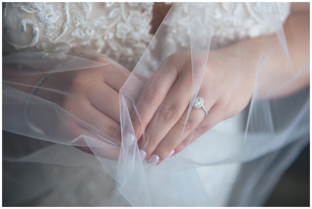 bride holding her veil over her hands at The Molly Pitcher Inn