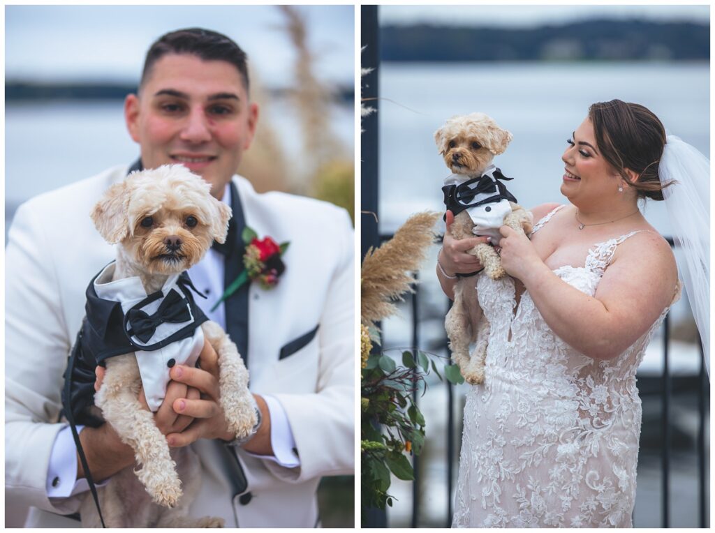bride holding her puppy wearing a tuxedo near the water at wedding venue
