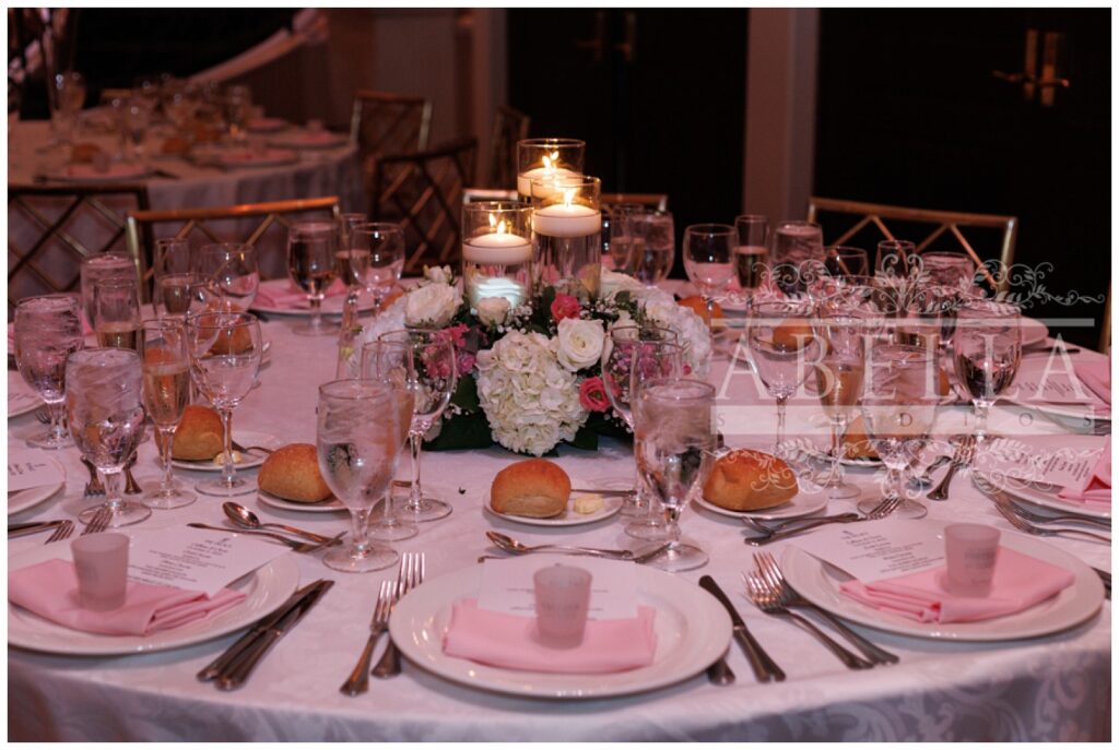 fully decorated reception table with candles and flowers at New Jersey wedding venue
