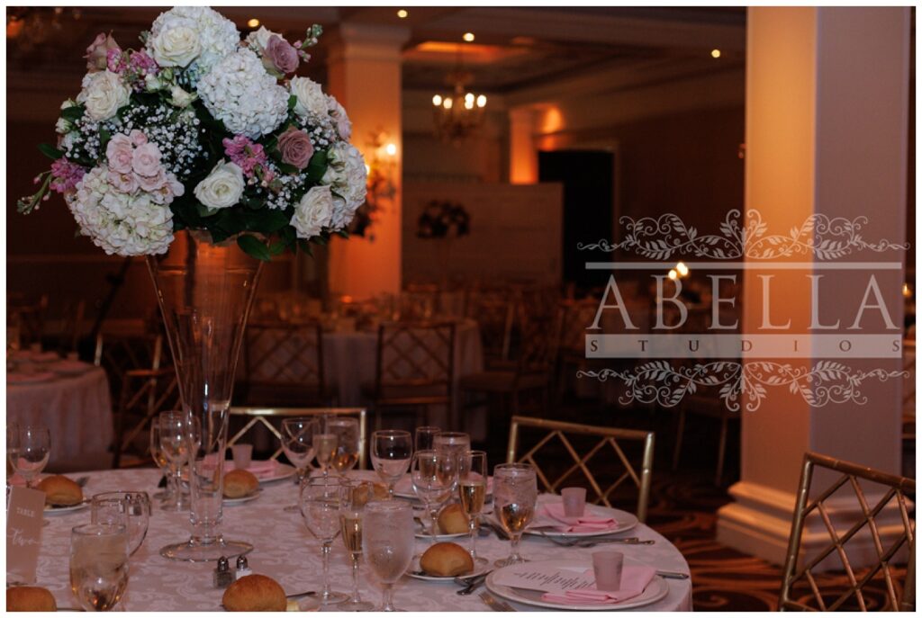 fully decorated reception table with large floral centerpiece at New Jersey wedding venue