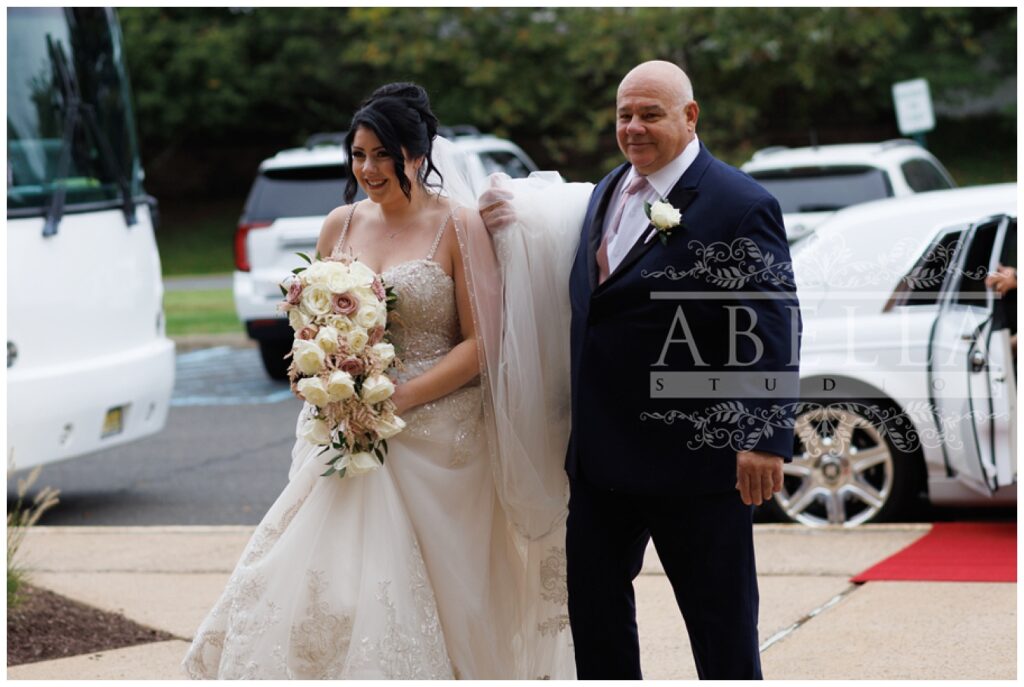 bride and her dad walking into the church in Somerset, New Jersey