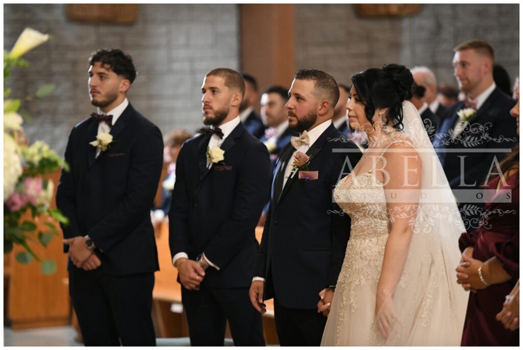 bride and groom at the altar at St. Matthias Catholic Church in New Jersey