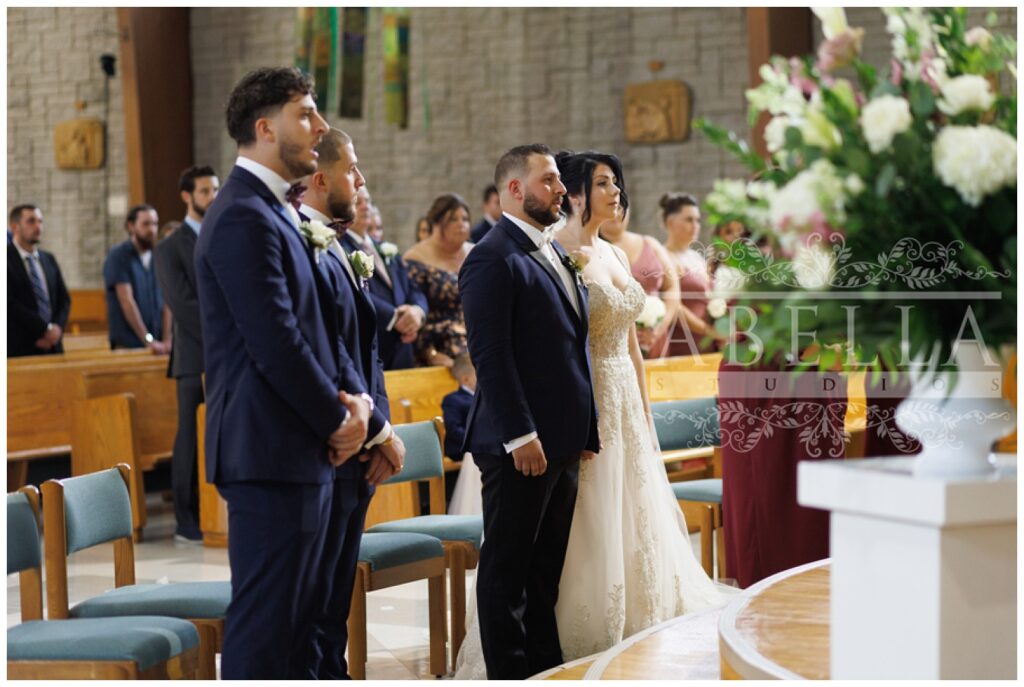 bride and groom standing together at St. Matthias Catholic Church in New Jersey