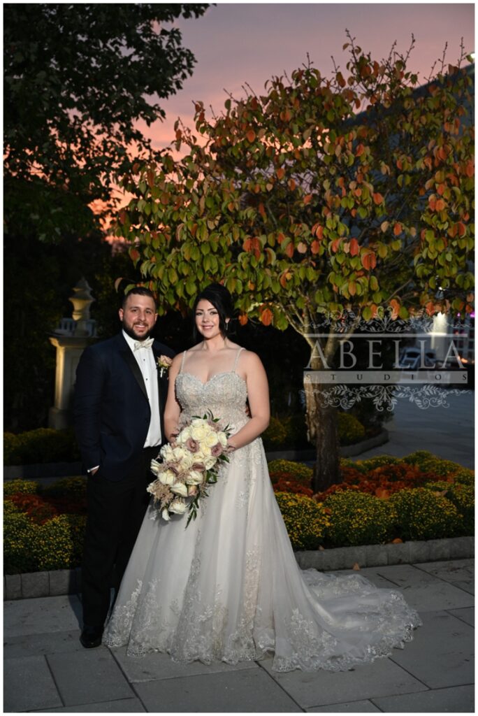 wedding couple posing in front of a tree at Somerset venue in New Jersey