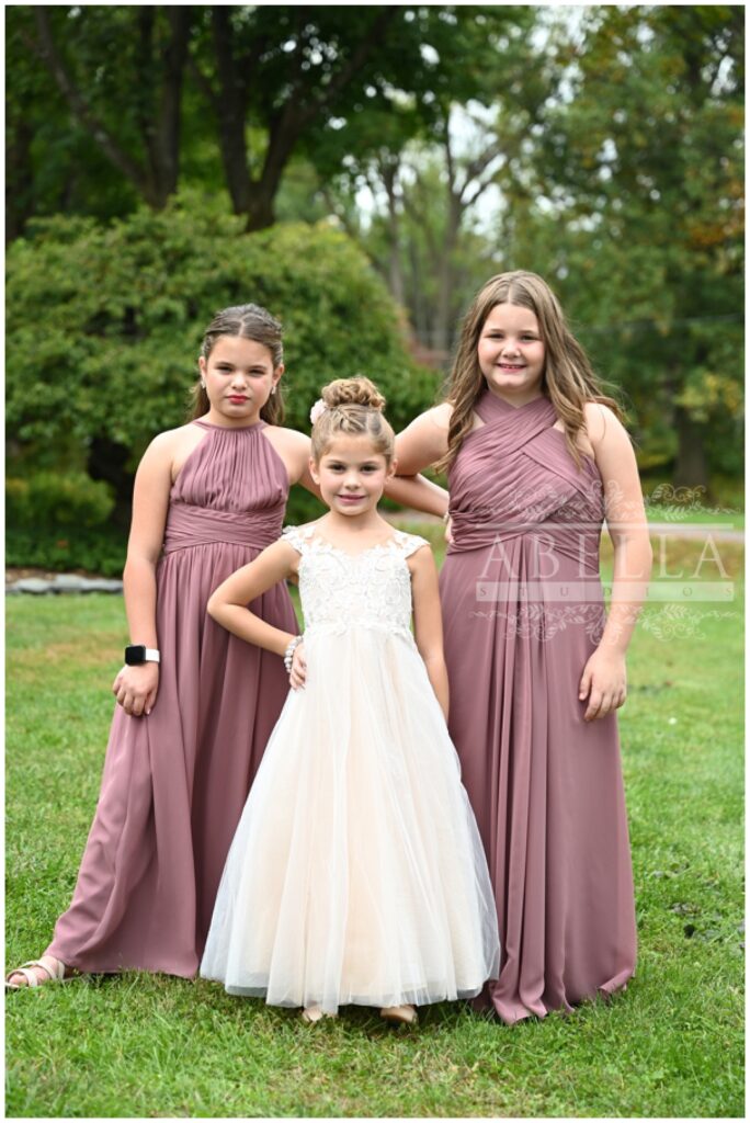 flower girl and junior bridesmaids posing outside together at The Palace at Somerset