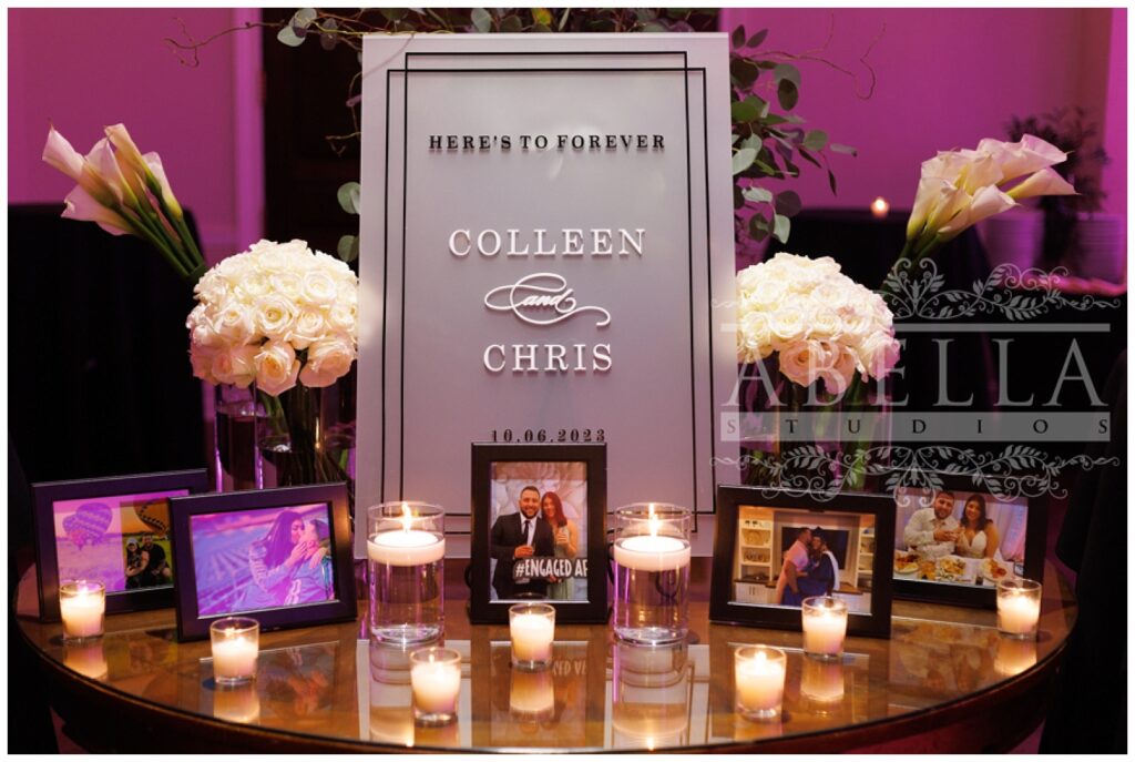 table with candles and pictures of the wedding couple at the reception in New Jersey