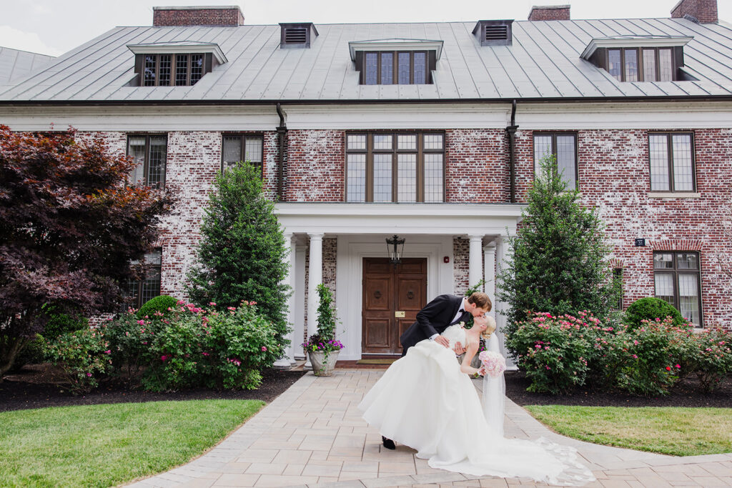 Couple infront of Hamilton Farm Golf Club